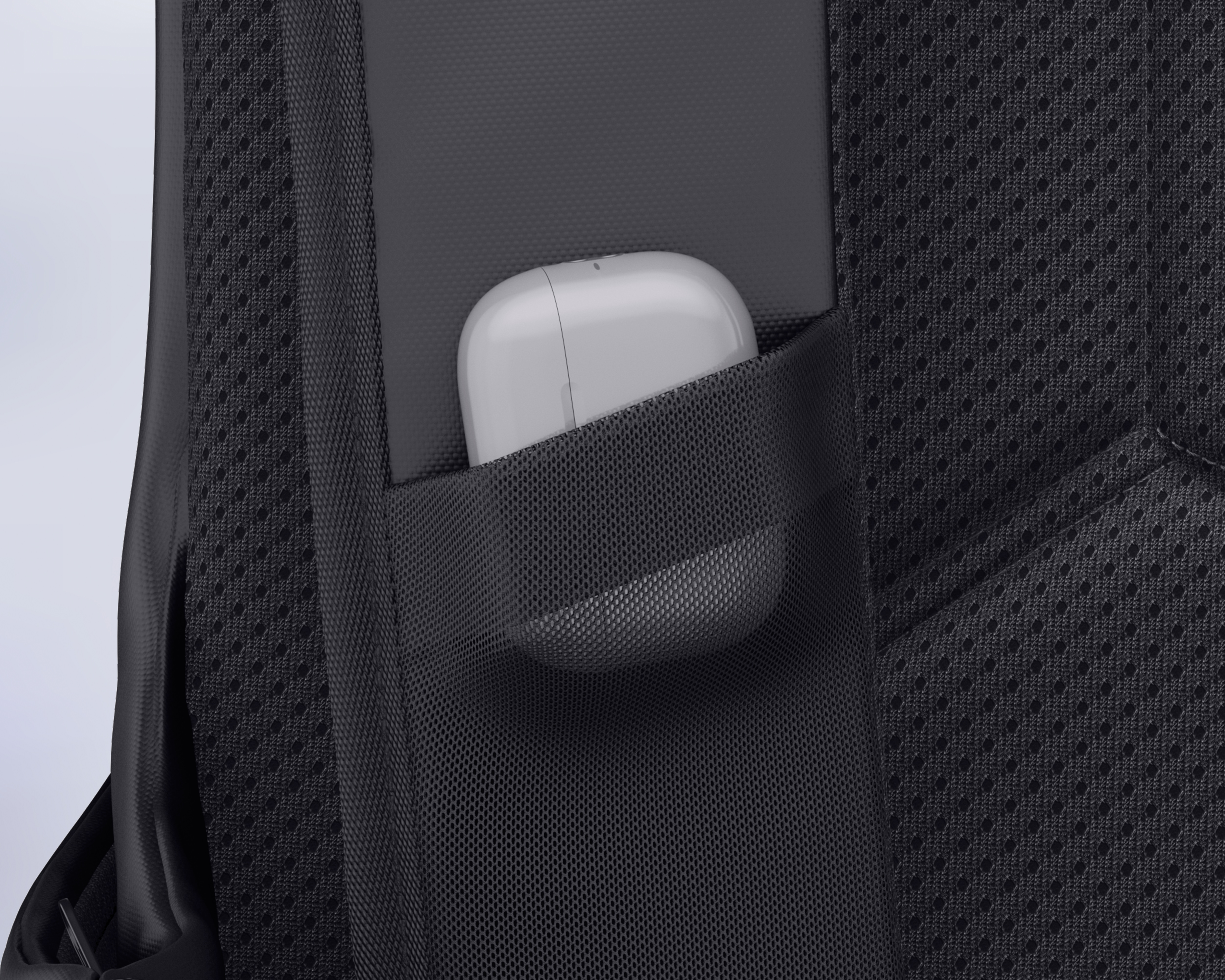 Close-up of backpack strap highlighting the earbud pocket