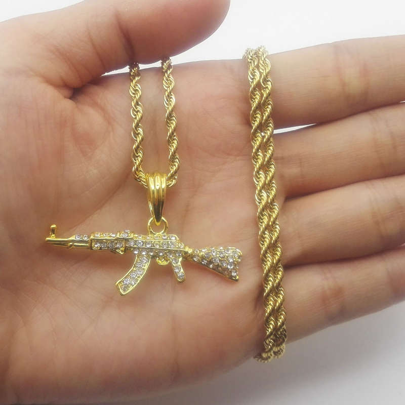 Golden AK47 Machine Gun pendant encrusted in Zirconia Jewels