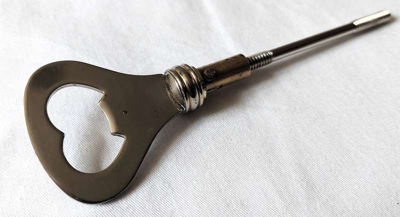 Rare Vintage Art Deco Styled Bottle Opener - Silver Plated inlaid handle with brass which is desi...