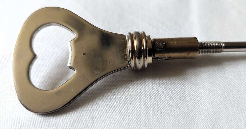 Rare Vintage Art Deco Styled Bottle Opener - Silver Plated inlaid handle with brass which is desi...