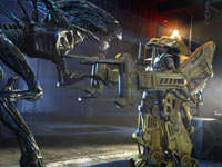 Battling an attacking alien queen using a powerloader in Aliens: Colonial Marines