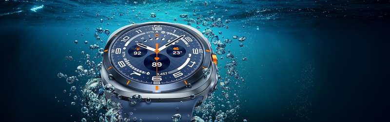 A Galaxy Watch Ultra is seen close-up in the water near the surface, showcasing its design.
