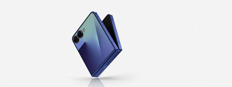 Galaxy Z Flip7 in Blue Shadow is on an angle and slightly unfolded showing the cover screen. Galaxy AI.