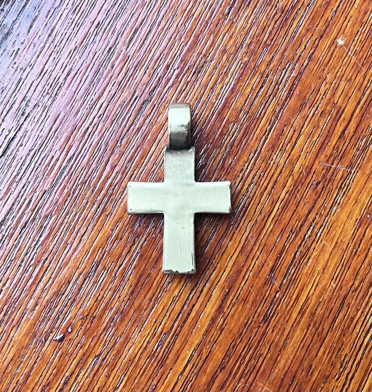 Metal cross pendant with decorative stones