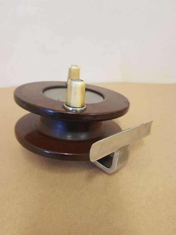 Wooden fishing reel.