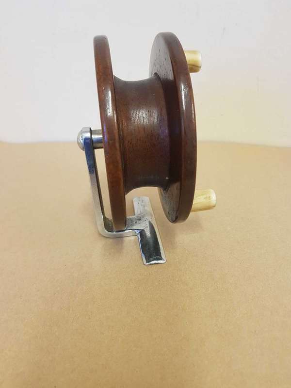 Wooden fishing reel.