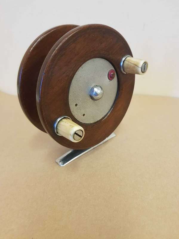 Wooden fishing reel.