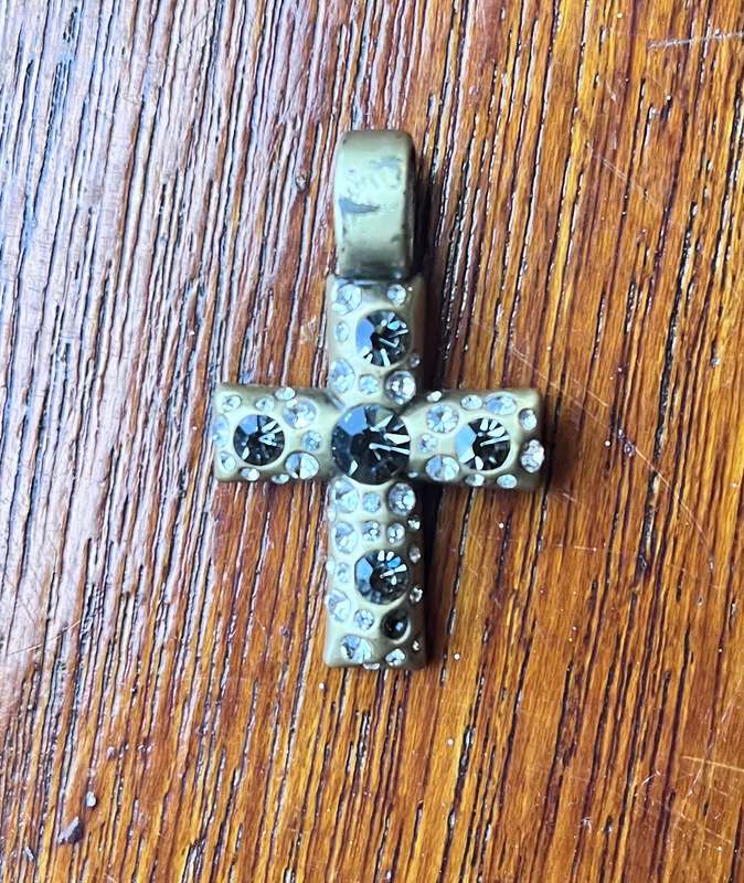 Metal cross pendant with decorative stones