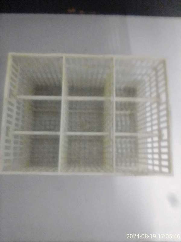 DISHWASHER CUTLERY BASKET.