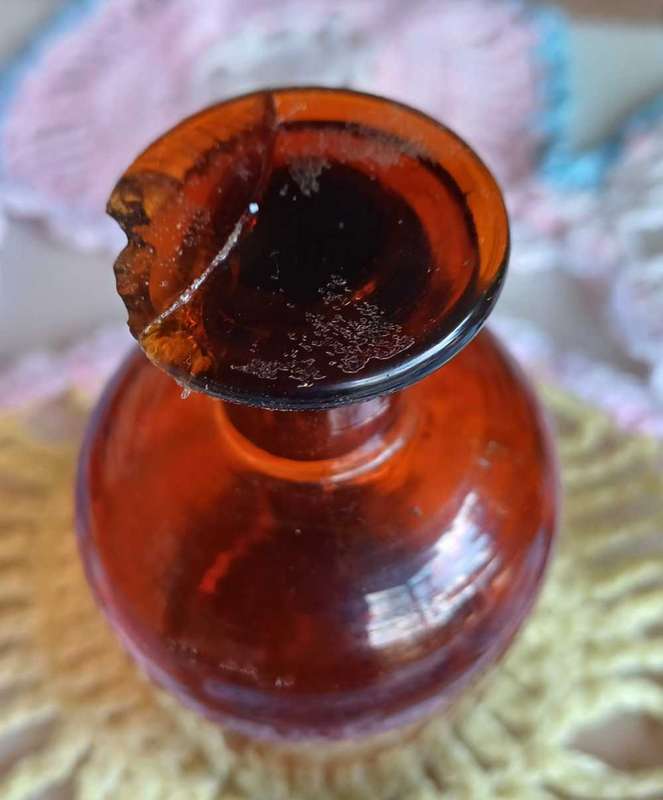 Vintage amber glass bottle with glass stopper