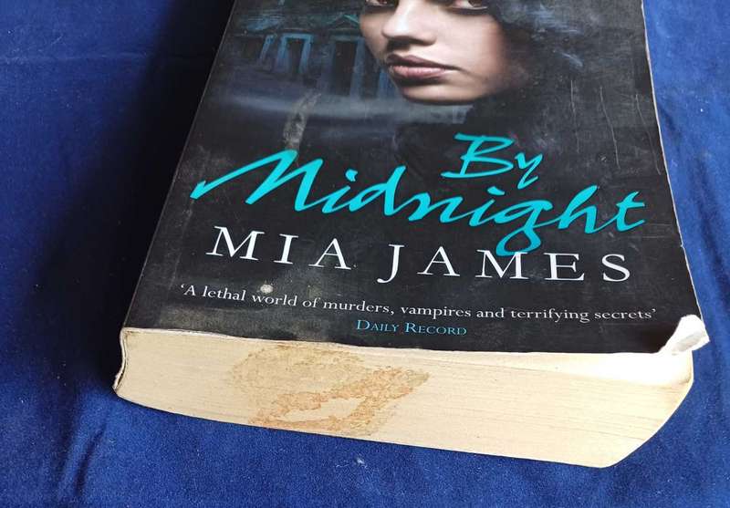 By midnight by Mia James