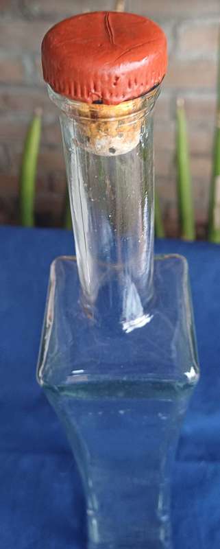 Tall glass bottle