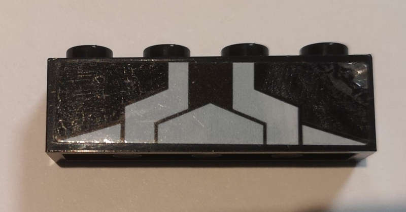 Lego (U) ~ Brick 1 x 4 with White Triangle and Stripes Pattern (Sticker) - Set 76103 ~ [Black]