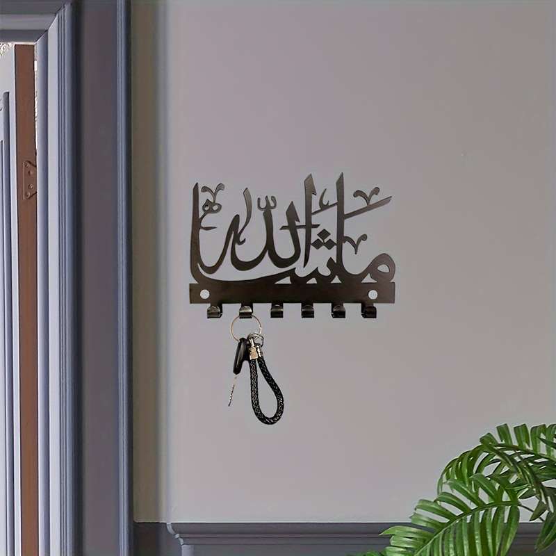 A charming Islamicinspired key holder that combines storage and towelhanging functions