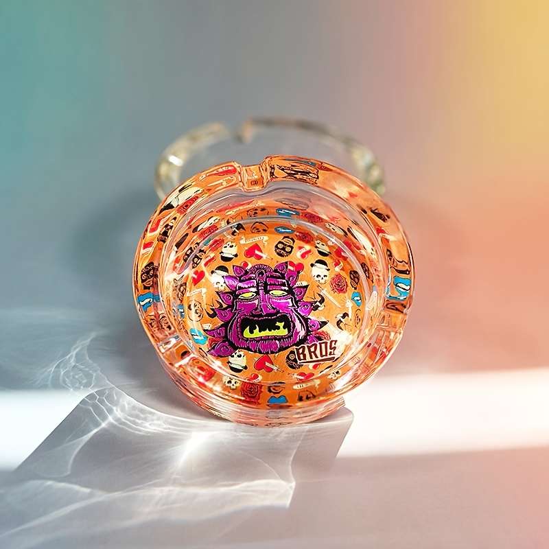 1pc Creative Patterned Glass Ashtray Round Transparent Design with Vibrant Monster Graffiti