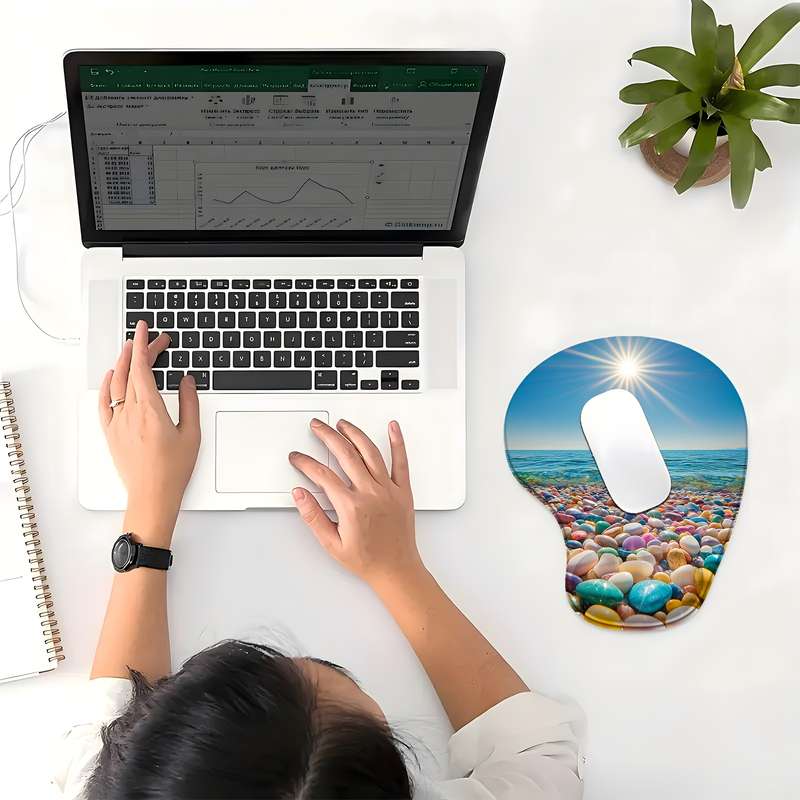 1pc This ergonomic mouse pad inspired by pebble-strewn beaches and sunny beaches has a