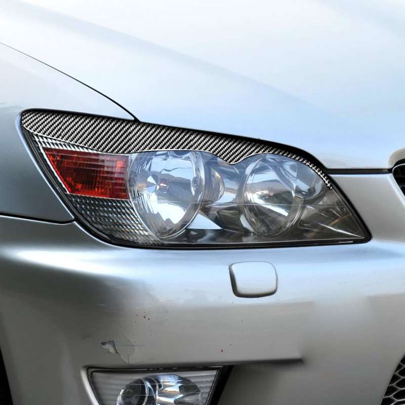 2 PCS / Set Carbon Fiber Car Lamp Eyebrow Decorative Sticker for Lexus IS200 1998-2005, Drop Glue Ve