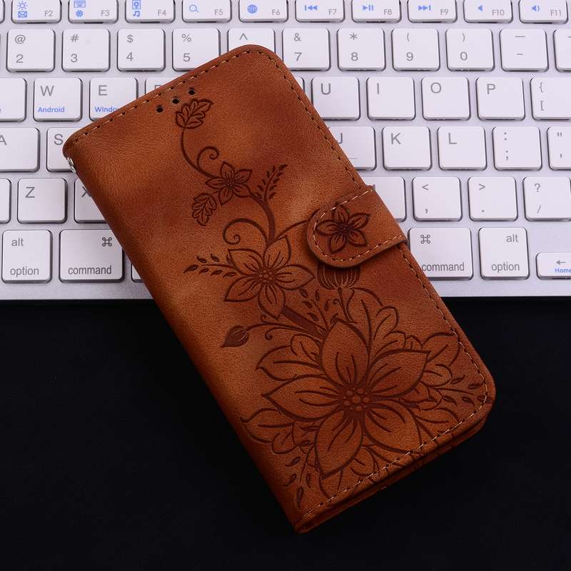 For iPhone 16 Lily Embossed Leather Phone Case(Brown)