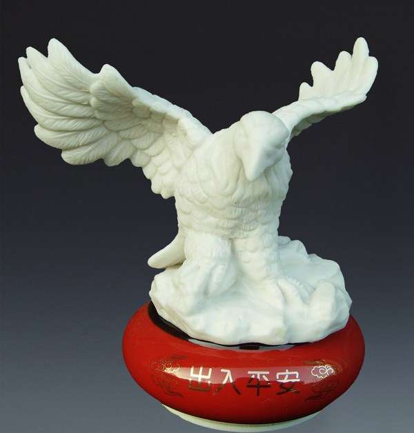 Eagle with perfume container