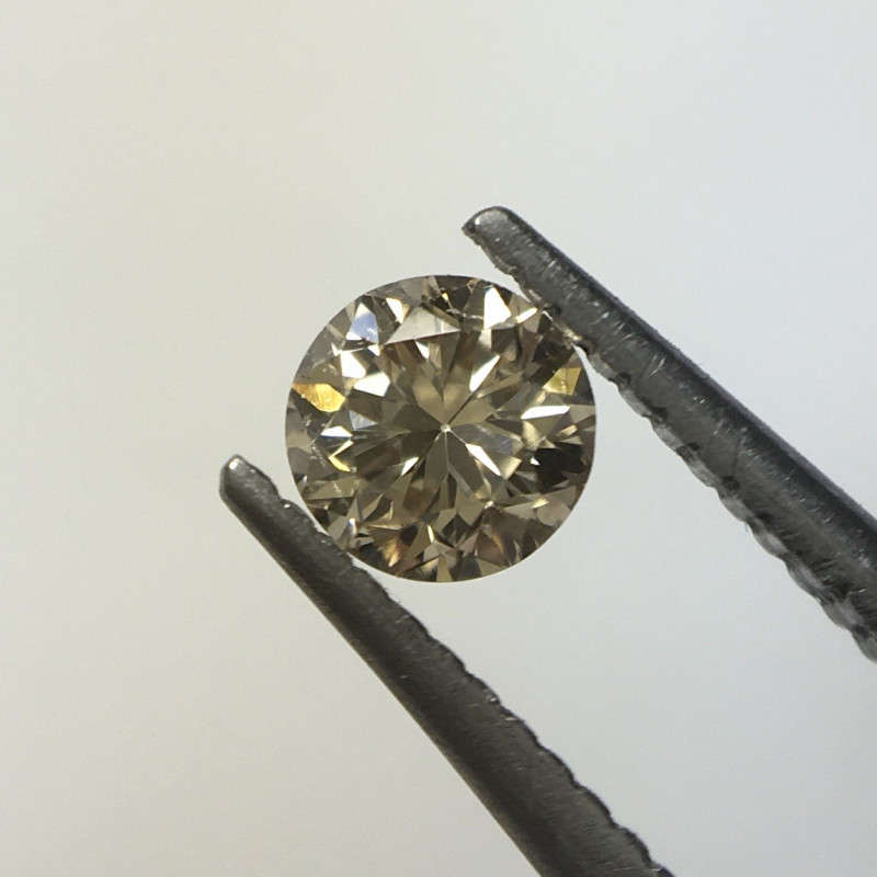 0.13 ct fancy brown VS/Si1 round brilliant diamond