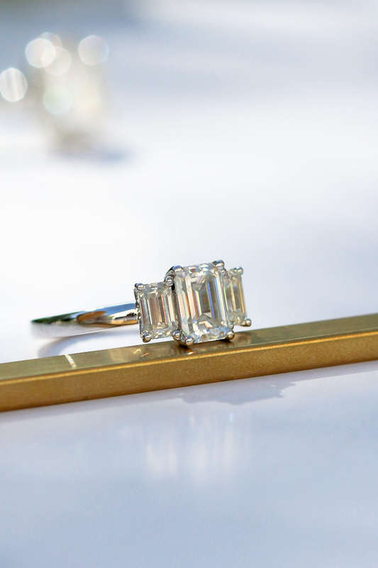 1ct Emerald Cut Moissanite Trilogy Ring in Platinum