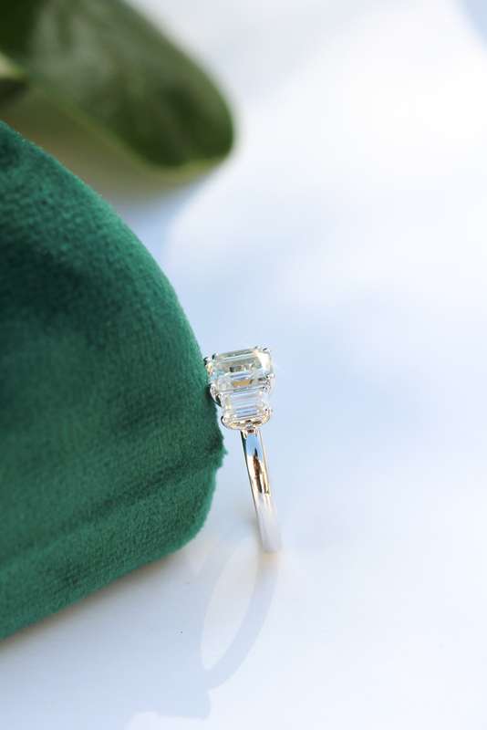 1ct Emerald Cut Moissanite Trilogy Ring in Platinum