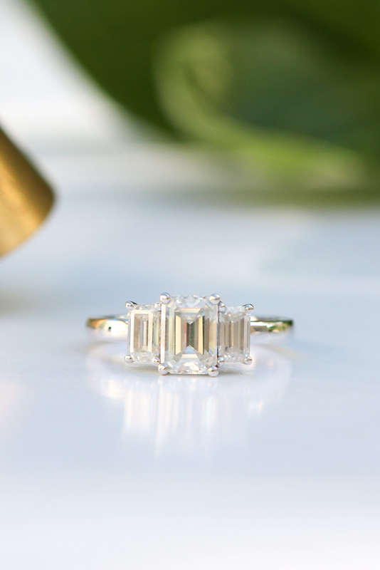 1ct Emerald Cut Moissanite Trilogy Ring in Platinum