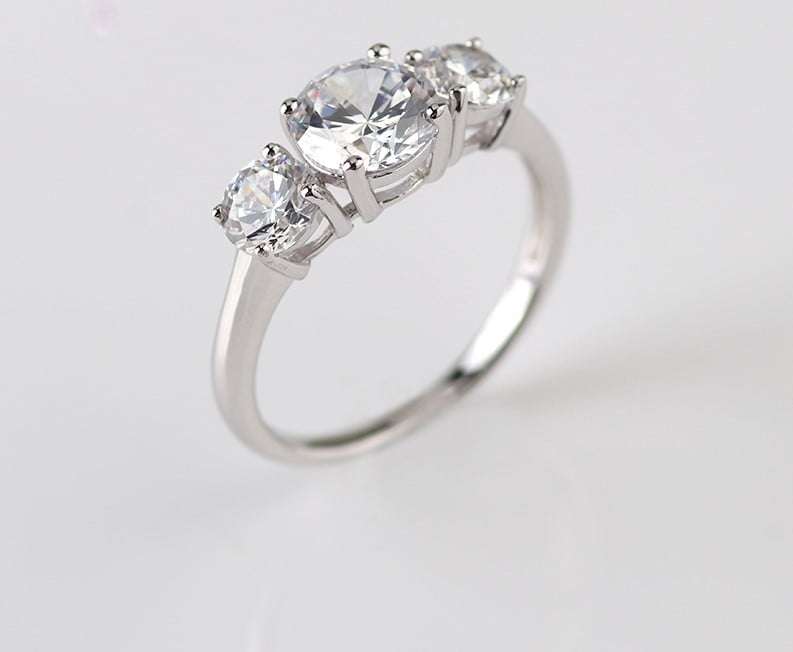 Trilogy Moissanite Engagement Ring
