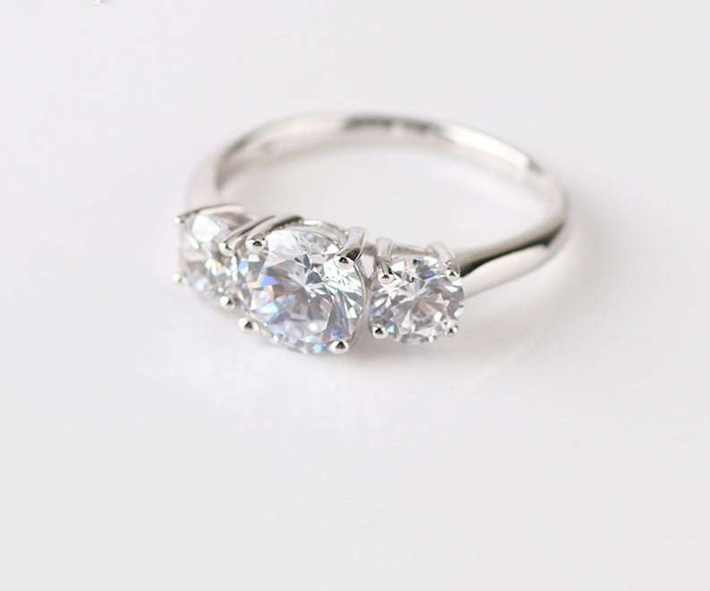 Trilogy Moissanite Engagement Ring