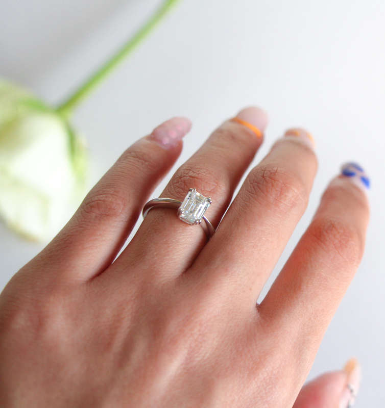 Double Claw Emerald Moissanite Engagement Ring