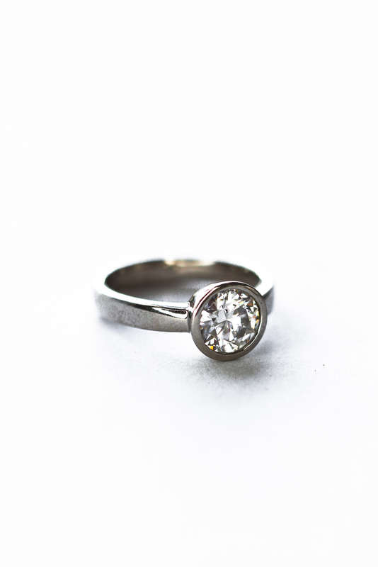 The Platinum Bezel Moissanite Ring