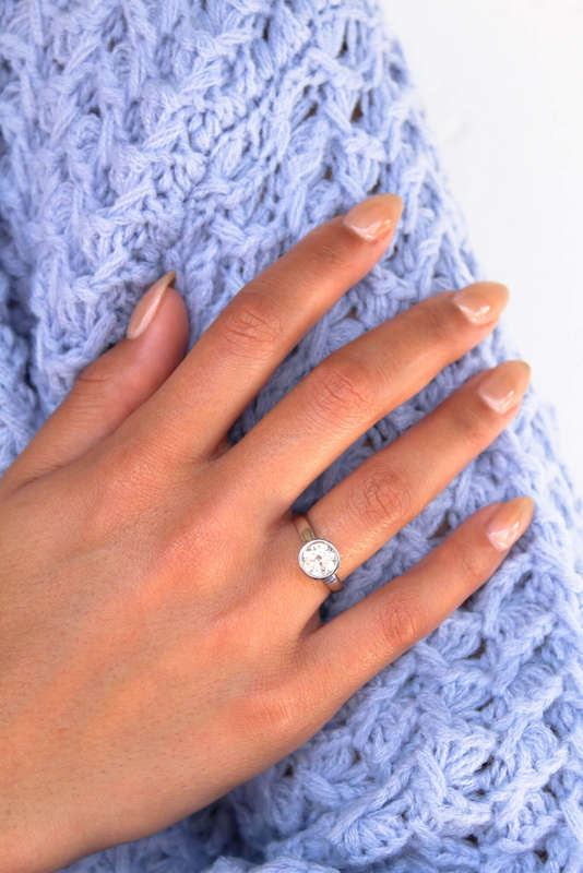 The Platinum Bezel Moissanite Ring