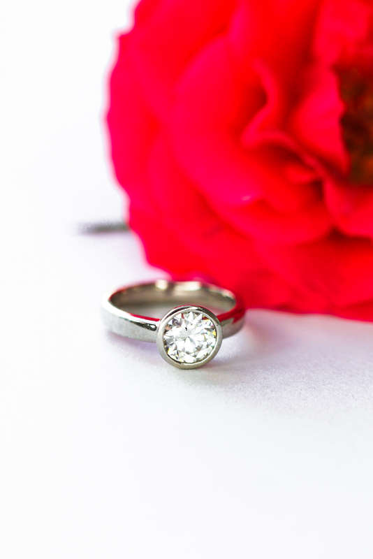 The Platinum Bezel Moissanite Ring