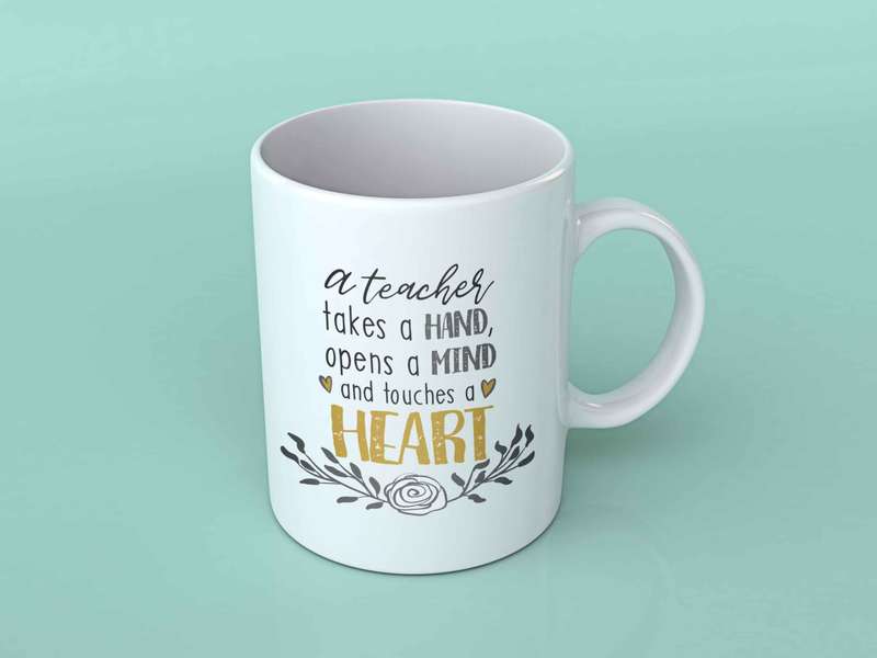 A teacher takes a hand coffee mug