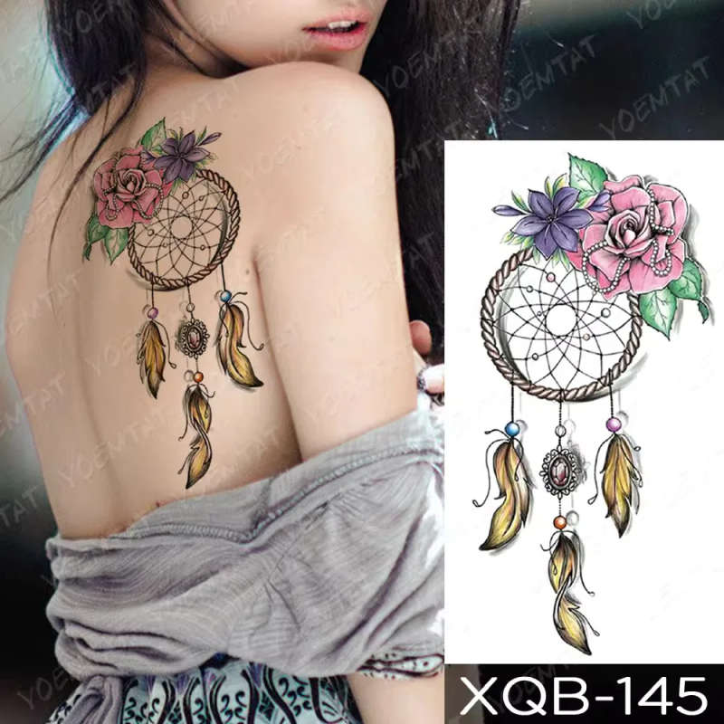 Dreamcatcher Delight - Whimsical Female Back Tattoo
