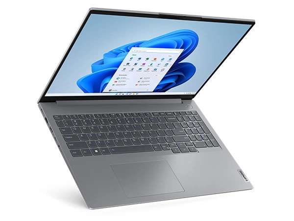 The Lenovo ThinkBook 16 Gen 6 laptop open 90 degrees, & seemingly standing up on the front edge of the keyboard.