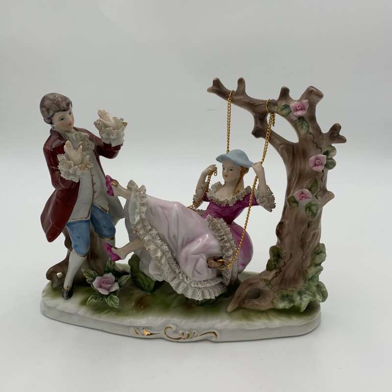 "Grown Staffordshire" Man Standing by Lady on Swing Figurine