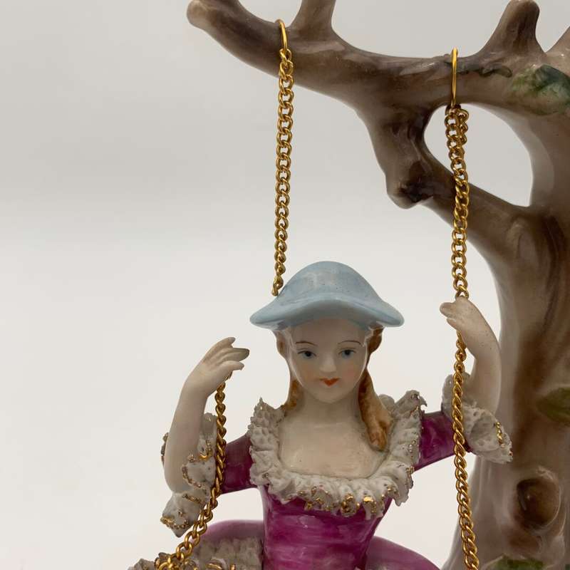 "Grown Staffordshire" Man Standing by Lady on Swing Figurine