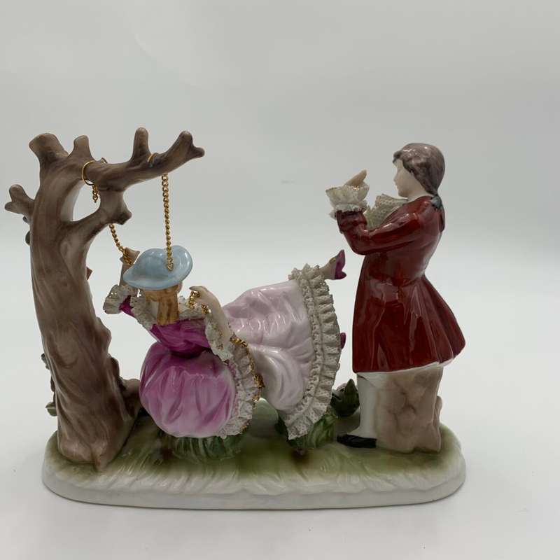 "Grown Staffordshire" Man Standing by Lady on Swing Figurine