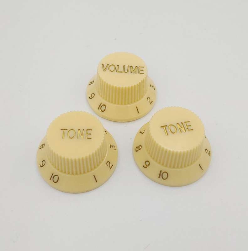 Ivory with Gold Writing Strat style replacement knob set - 1 Volume, 2 tone