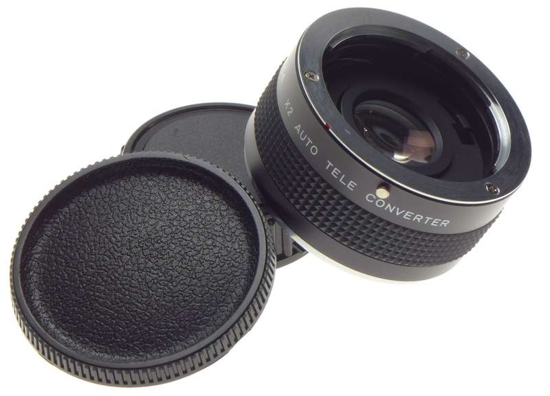 Yashica x 2 Auto Tele Converter Mint in box with caps. Perfectly clean glass.