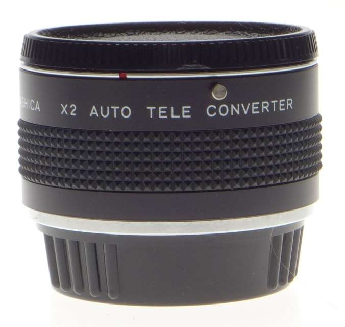 Yashica x 2 Auto Tele Converter Mint in box with caps. Perfectly clean glass.