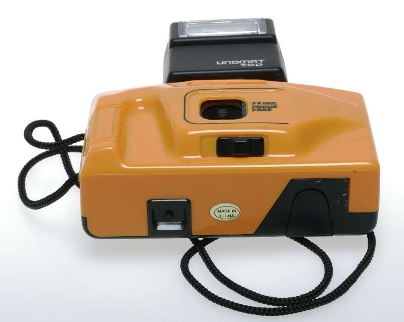 Yellow 35mm point and shoot focus free vintage film camera with flash