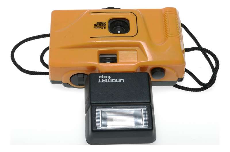 Yellow 35mm point and shoot focus free vintage film camera with flash