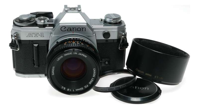 Canon AT-1 35mm film SLR camera FD 1:1.8 50mm lens filter cap shade hood