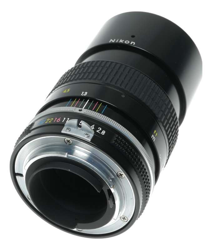 Nikon Ai Nikkor 1:2.8 135mm telephoto MF camera lens caps keeper