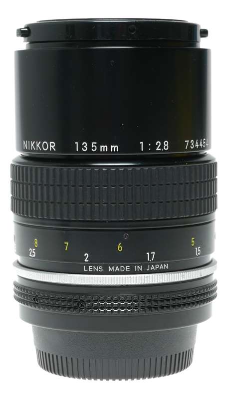 Nikon Ai Nikkor 1:2.8 135mm telephoto MF camera lens caps keeper