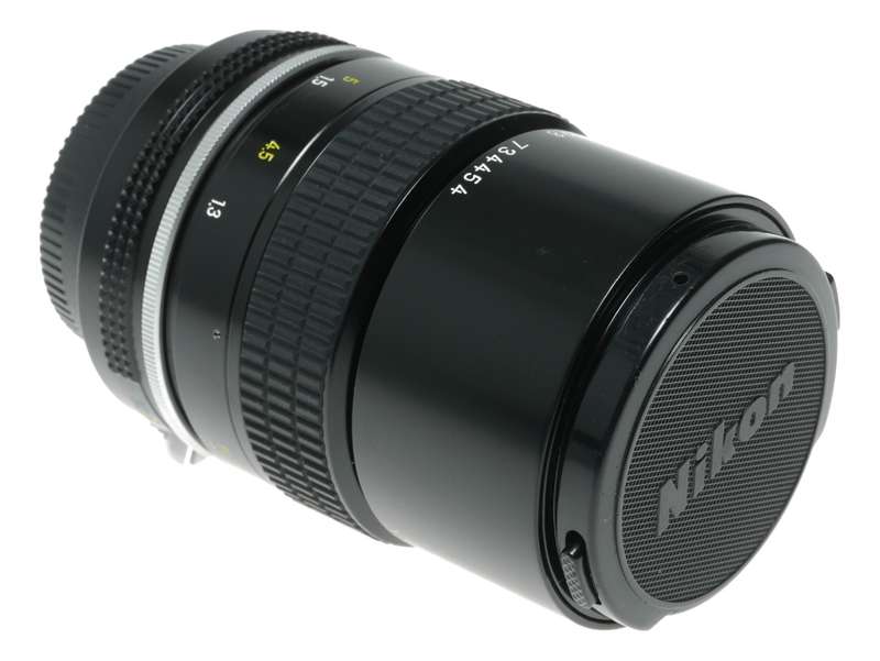 Nikon Ai Nikkor 1:2.8 135mm telephoto MF camera lens caps keeper