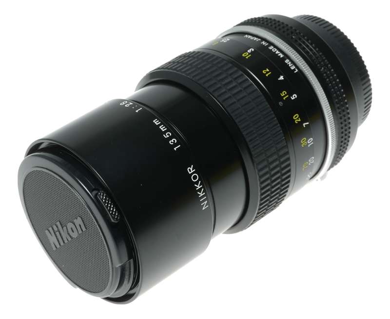 Nikon Ai Nikkor 1:2.8 135mm telephoto MF camera lens caps keeper