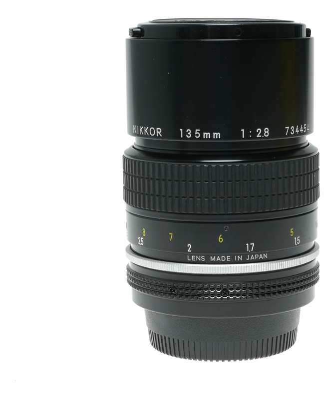 Nikon Ai Nikkor 1:2.8 135mm telephoto MF camera lens caps keeper